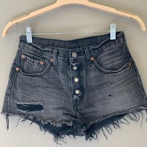 Levi’s 501 distressed black jean shorts. Size 26.